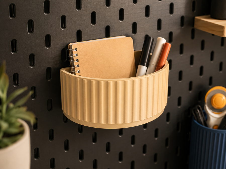 Cream fluted storage cup holding a notebook and pens